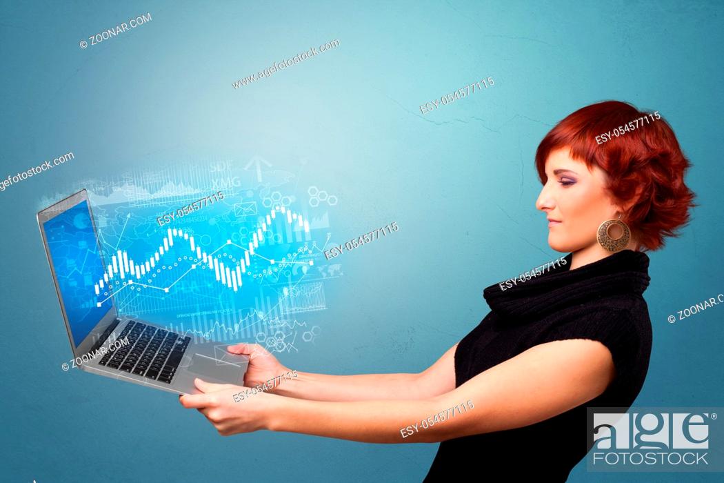 Stock Photo: Woman holding laptop projecting financial information, diagrams and charts.