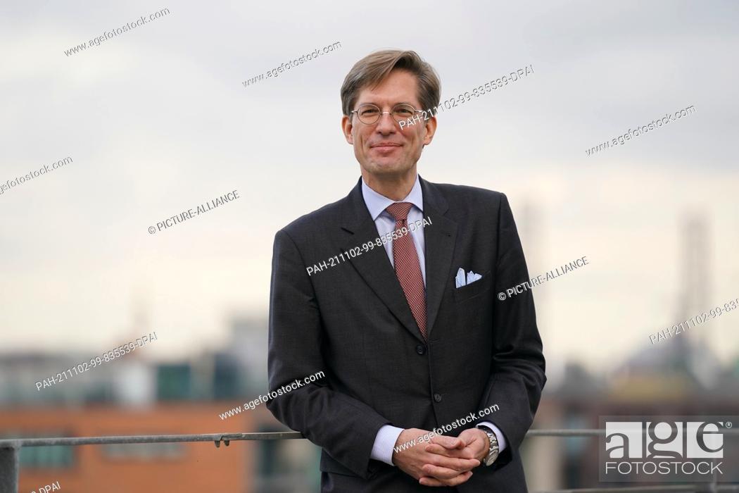 Stock Photo: 02 November 2021, Hamburg: Nils Weiland, deputy chairman of the Hamburg SPD, stands on a roof terrace in Hafencity. The Hamburg SPD is to be led by a dual.