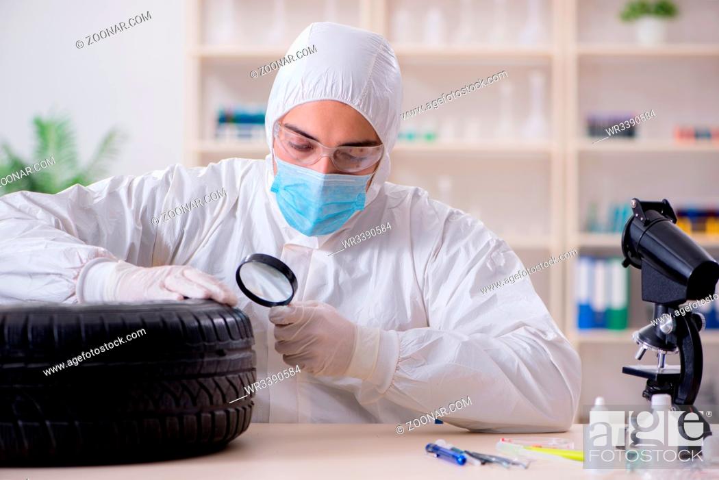 Stock Photo: Expert is looking at car accident evidence.