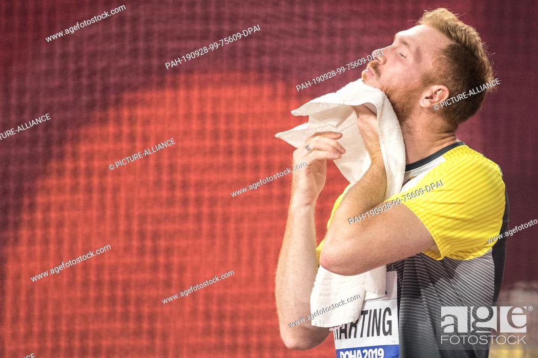 Stock Photo: 28 September 2019, Qatar, Doha: Athletics, IAAF World Championships at Khalifa International Stadium: Diskus, Men, Christoph Harting from Germany wipes off.