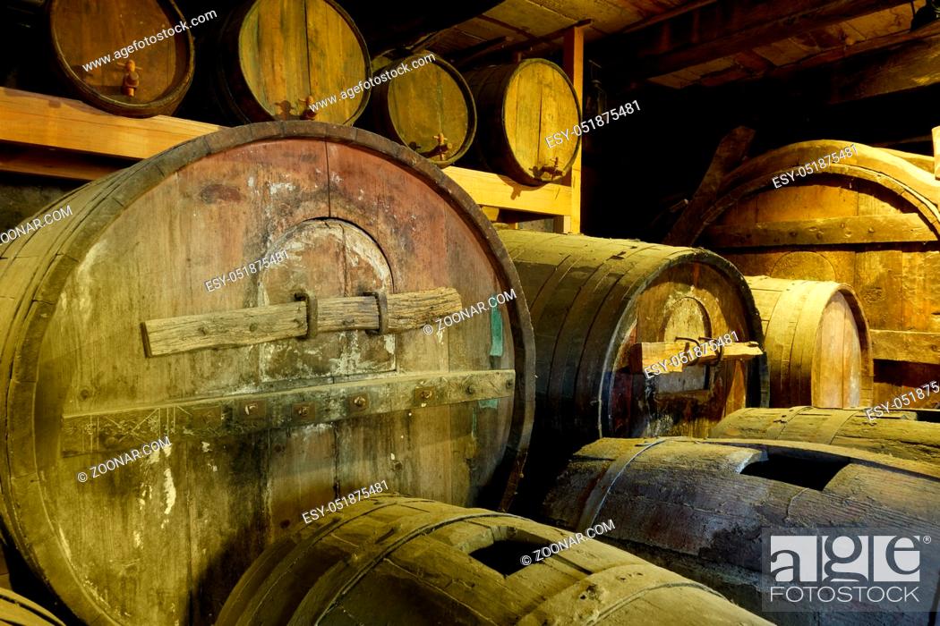 Photo de stock: Old wine barrels in cellar close-up.