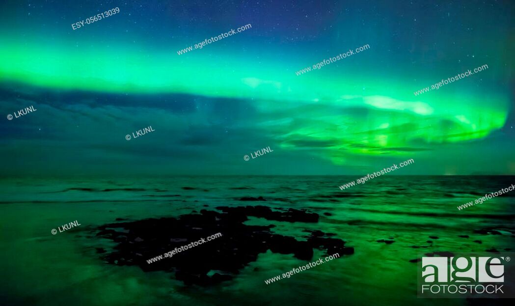 Stock Photo: Aurora borealis over the sea, Gardur, Iceland.