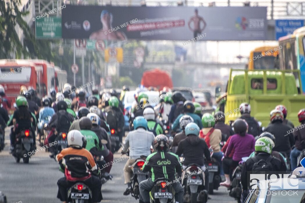 Stock Photo: Motorbike Grab service in Jakarta, Indonesia.