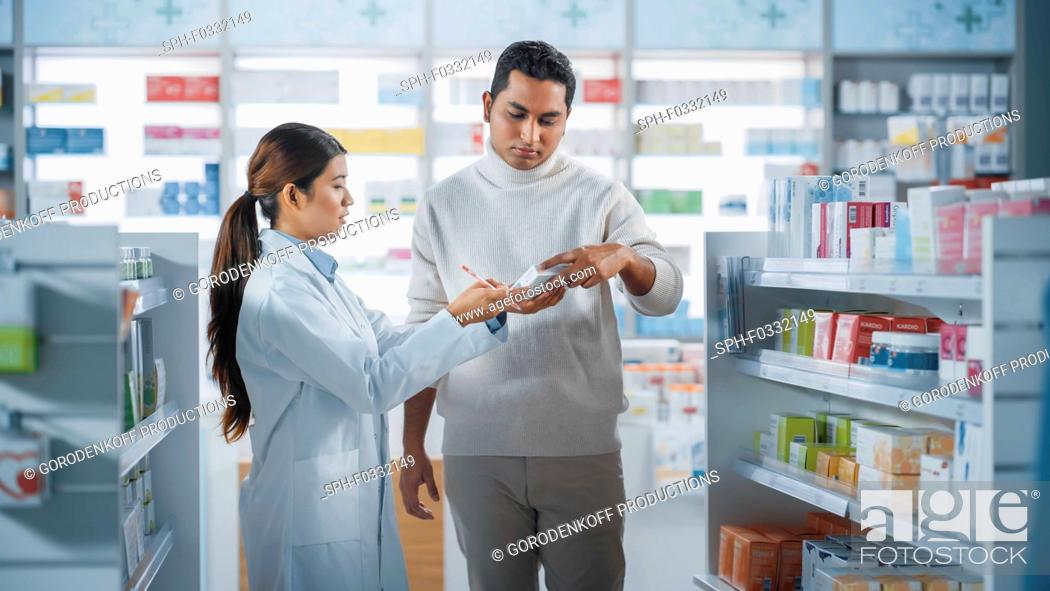 Stock Photo: Pharmacist helping a customer.