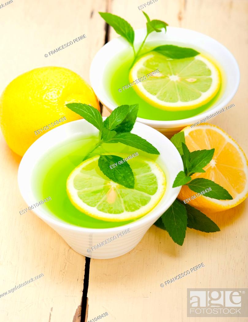 Stock Photo: fresh and healthy mint infusion tea tisane with lemon.