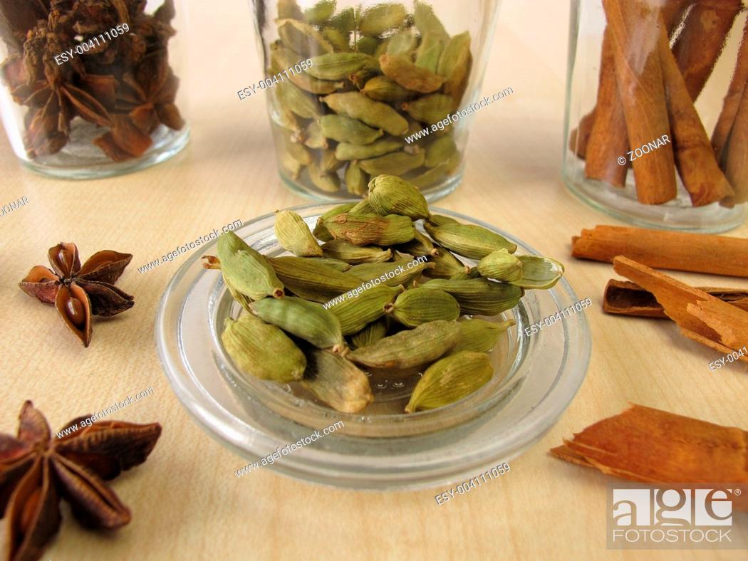 Stock Photo: Spice jars with cardamom, cinnamon and star anise.