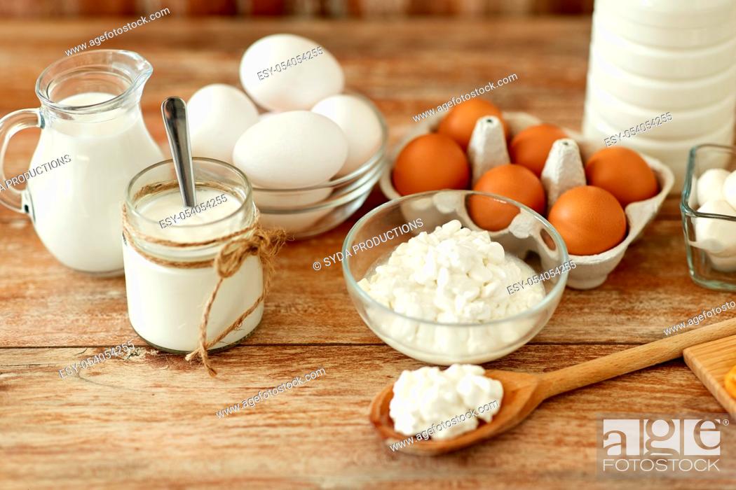 Stock Photo: cottage cheese, yogurt, milk and chicken eggs.