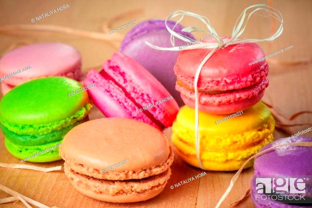 Stock Photo: traditional french colorful macarons with a bow.