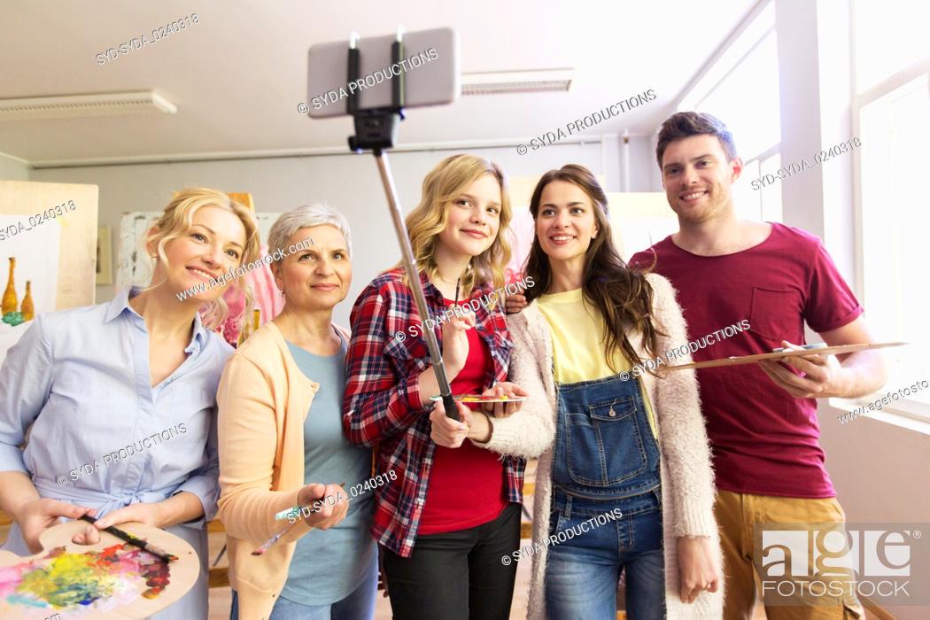 Stock Photo: group of artists taking selfie at art school.