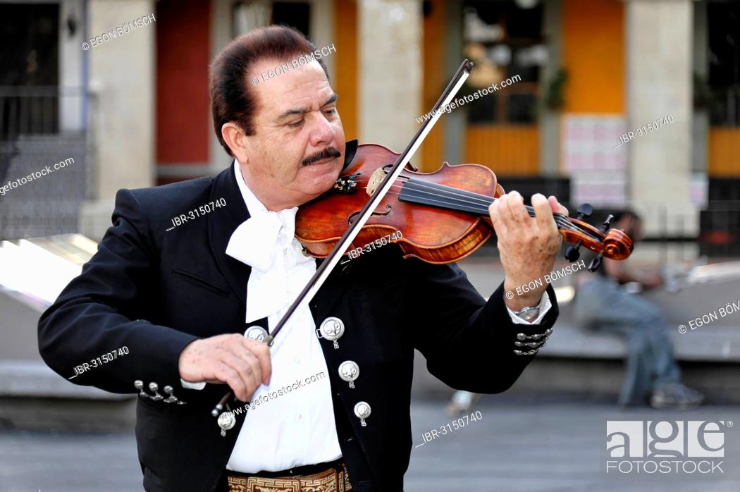Stock Photo: Mexican musician performing in Plaza Garibaldi, Mexico City, Federal District, Mexico.