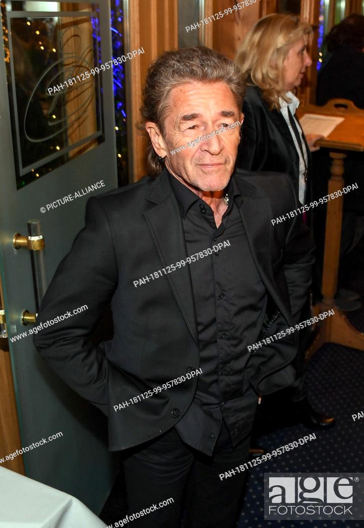 Stock Photo: 25 November 2018, Bavaria, München: Peter Maffay, musician, comes to the Aftershowparty after the film premiere of ""Tabaluga - Der Film"" in the Schuhbecks.