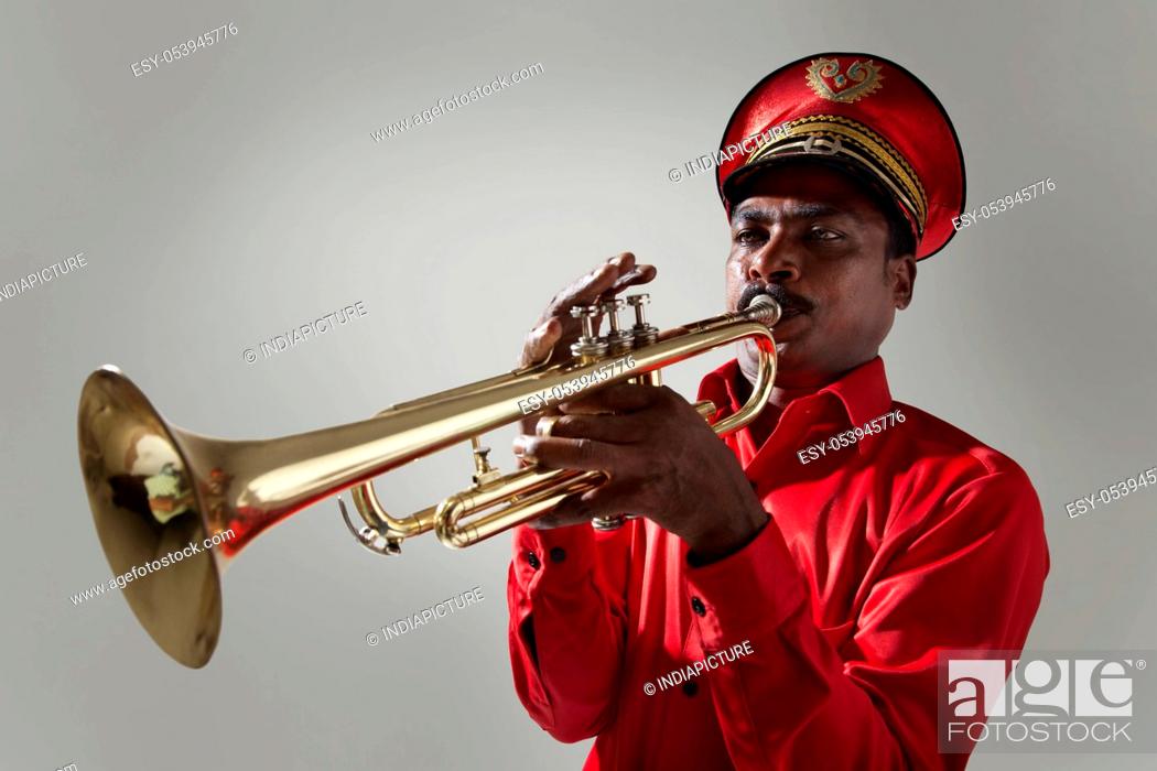 Stock Photo: Bandmaster playing on a trumpet.