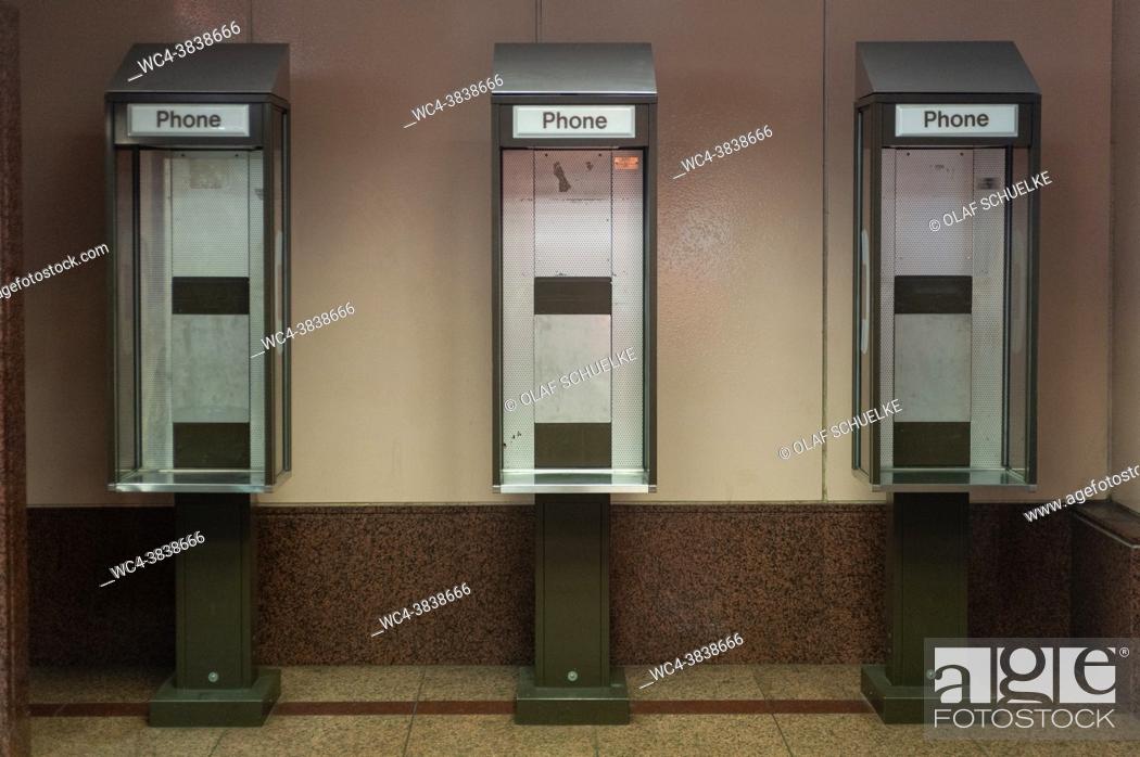 Stock Photo: Singapore, Republic of Singapore, Asia - Old, inoperative public payphone booths without phones at an underpass.