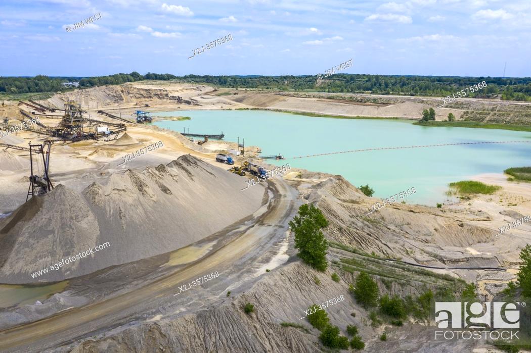 Stock Photo: Davisburg, Michigan - Holly Sand and Gravel, an aggregate mining operation owned by the Edward C Levy Company. The company's products are used in road building.