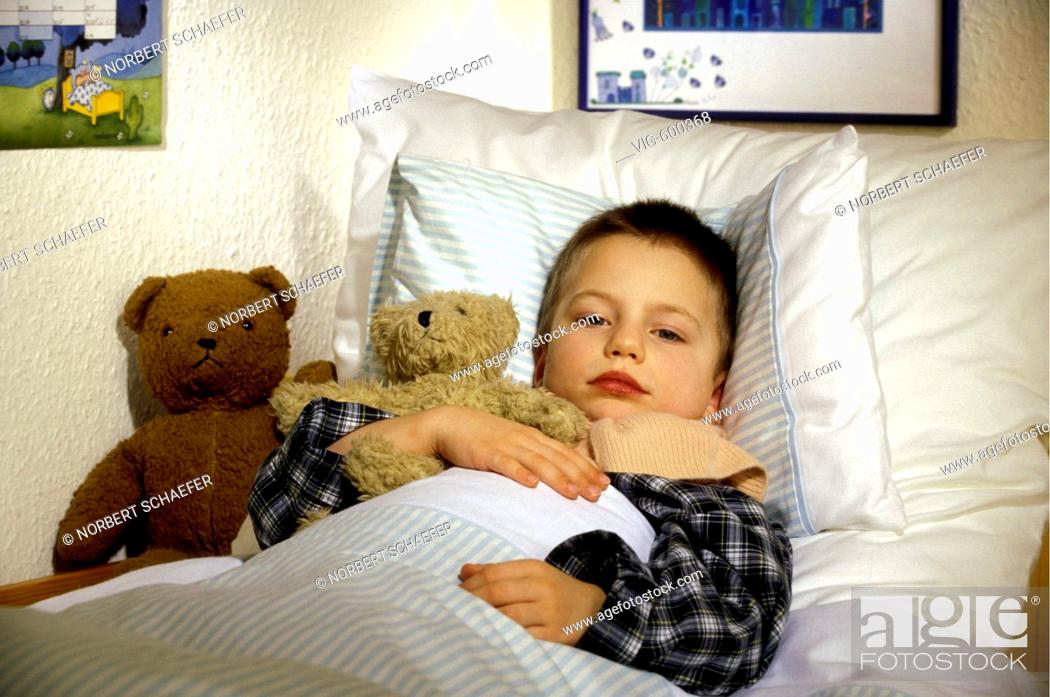 Stock Photo: Sick boy is lying in his bed. - 12/12/2007.