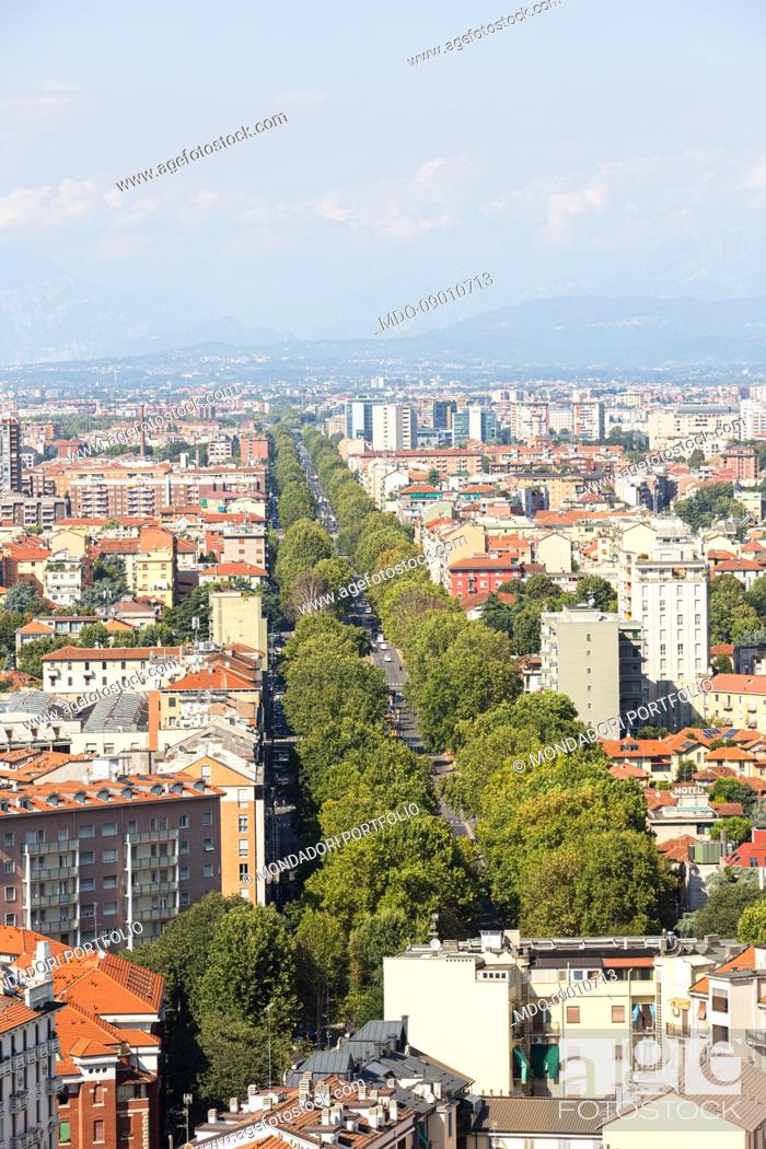 Stock Photo: Viale Zara lined with trees that starts from piazzale Lagosta and resumes from one of the Garibaldi Towers. Milan (Italy), August 26th, 2021.