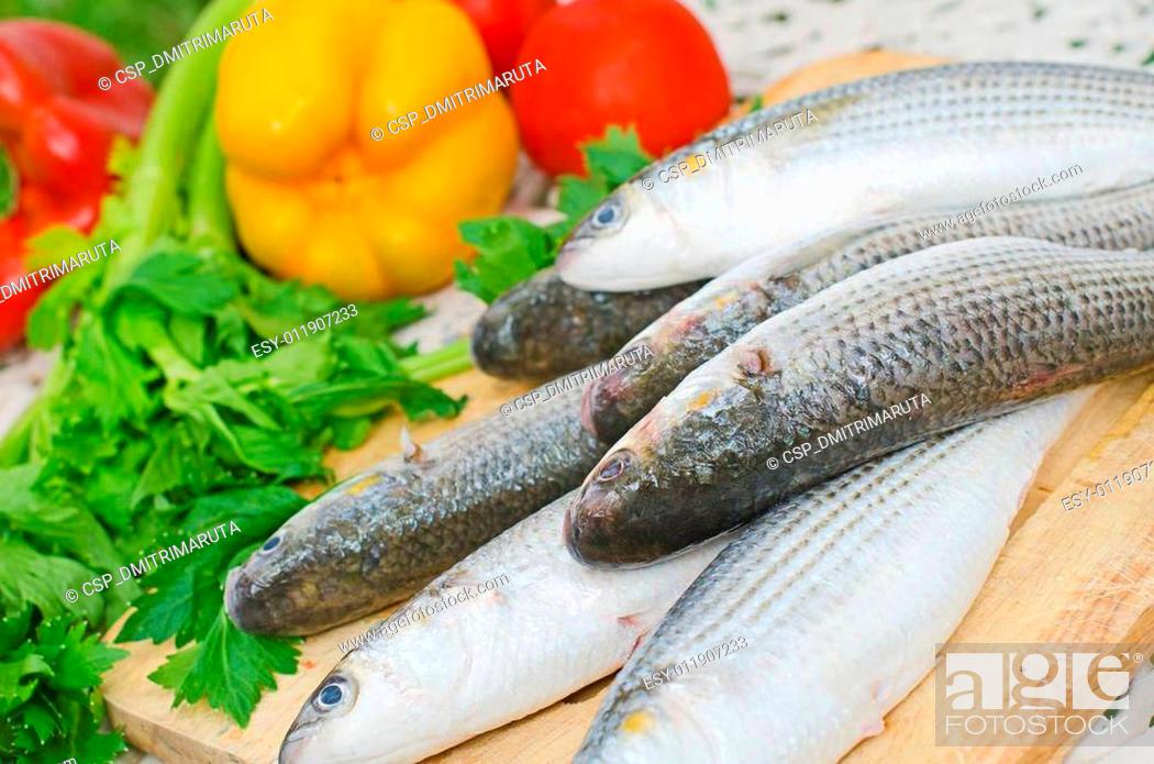 Imagen: Mugil cephalus fish with vegetables.