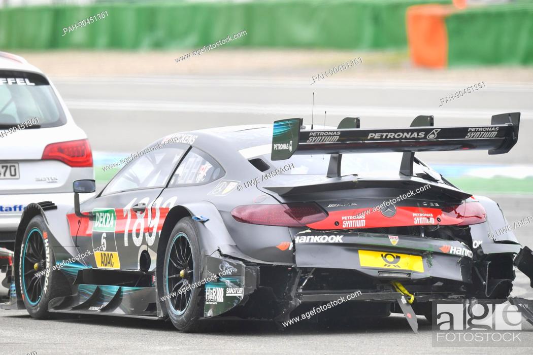 Stock Photo: The Mercedes-AMG C63 driven by Canada's Robert Wickens from Mercedes-AMG team HWA is towed away after an accident during the Deutsche Tourenwagen Masters (DTM.