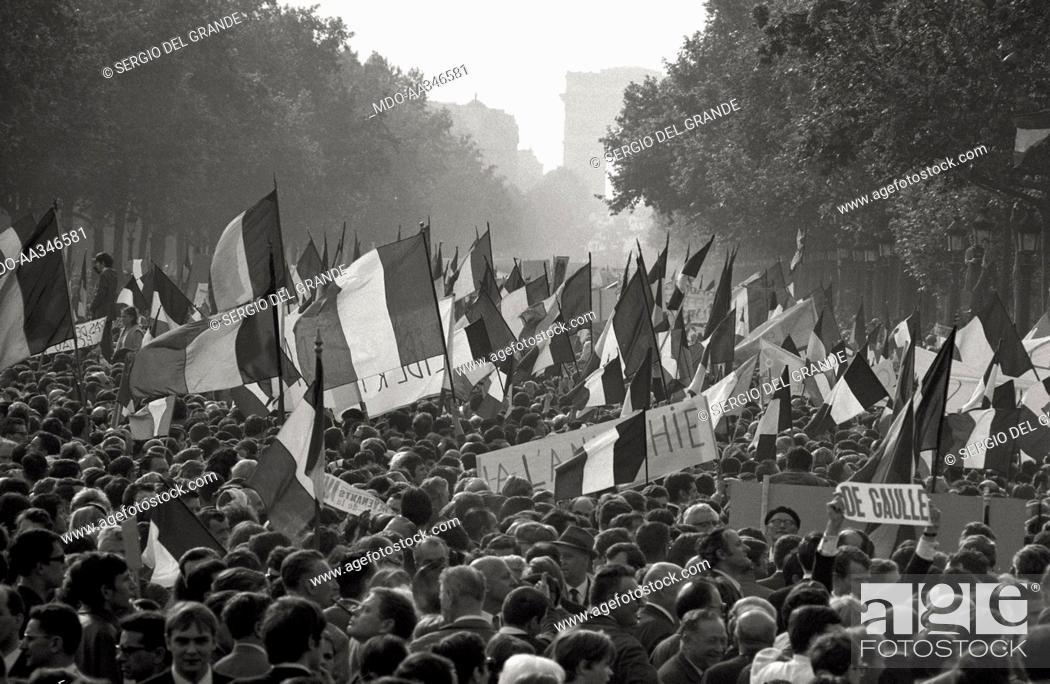 Stock Photo: The risk of a revolution in Paris has been averted. French flags on the Champs-Elysées in a demonstration of De Gaulle supporters.
