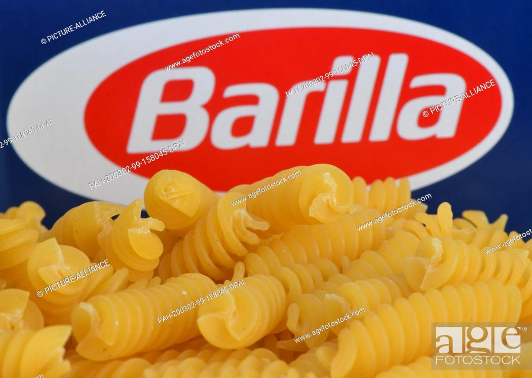 Stock Photo: 02 March 2020, Brandenburg, Grünheide: ILLUSTRATION - Barilla brand pasta is placed on a package (placed intake). While many German citizens are stocking up on.
