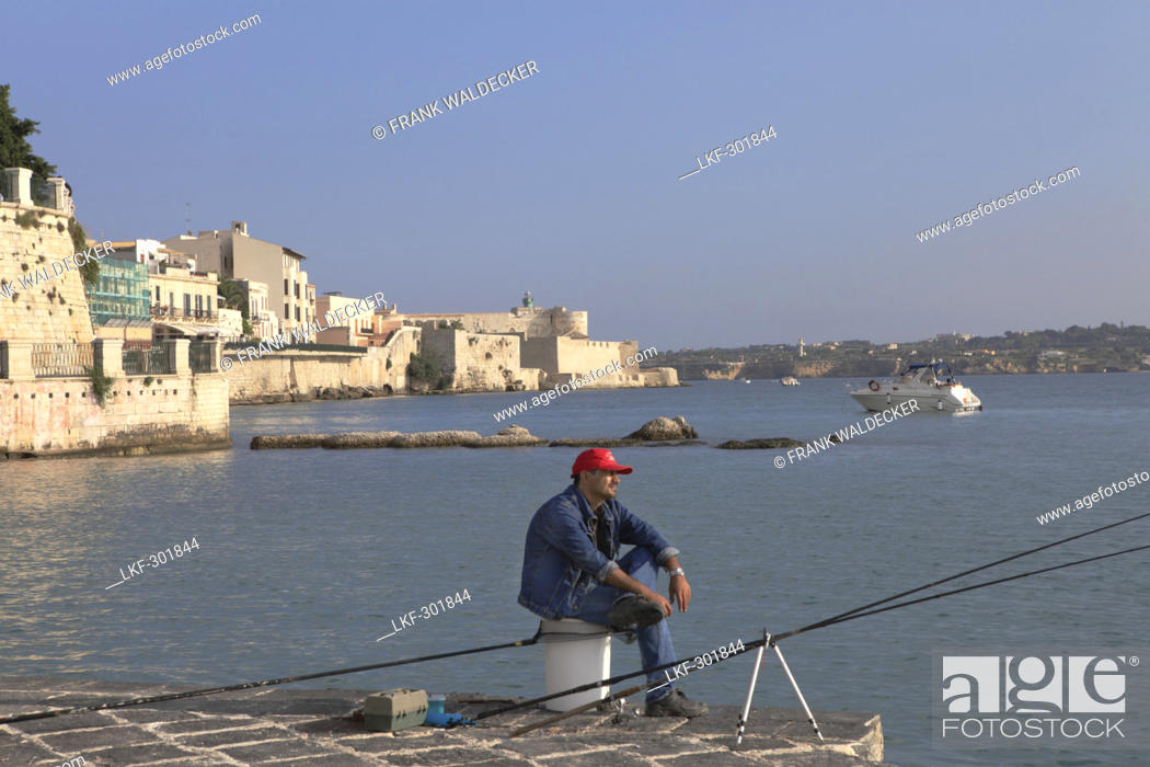 Stock Photo: Angler on the pier at Syracuse on the Ortygia Island, Unesco World Heritage, Province Syracuse, Sicily, Italy, Europe.