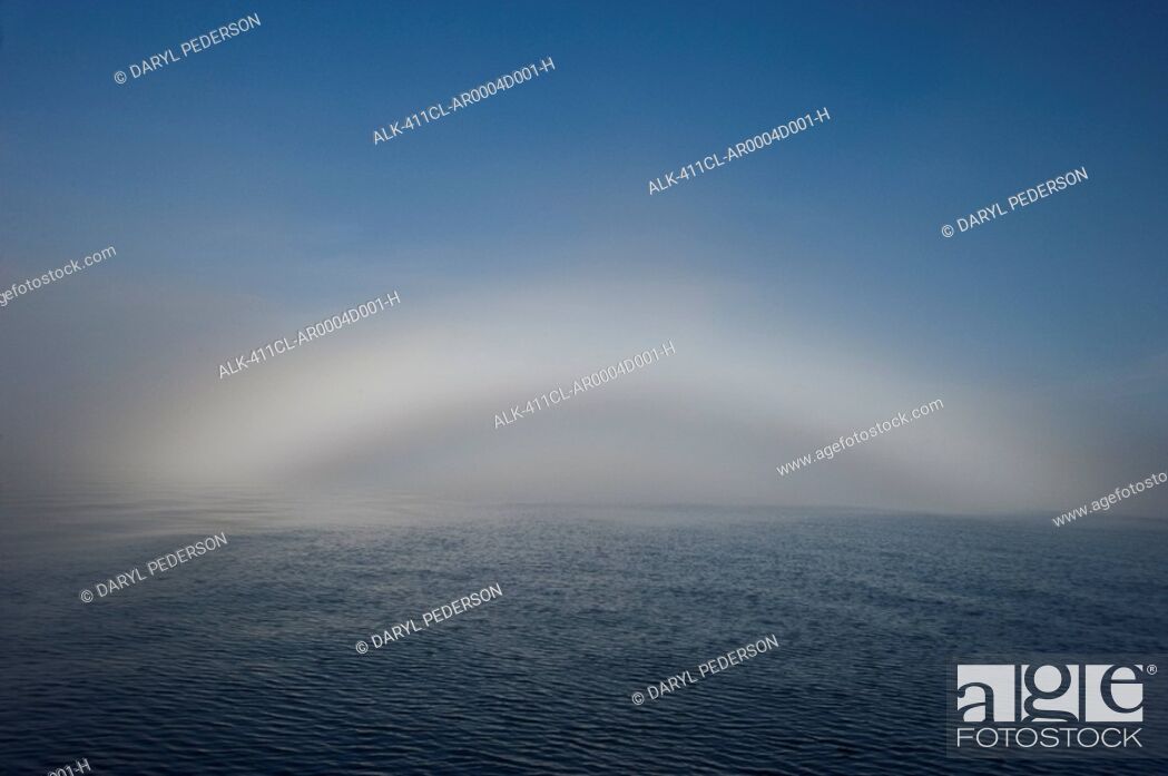 Stock Photo: A fogbow appears over the horizon in Prince William Sound during Autumn in Southcentral Alaska.