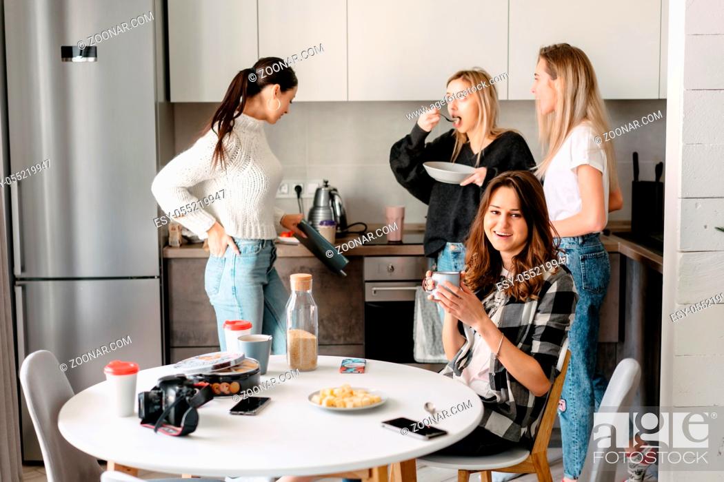 Stock Photo: group of women having fun in the kitchen.