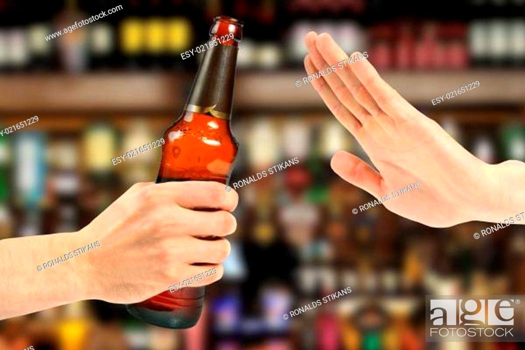 Stock Photo: hand reject a bottle of beer in the bar.