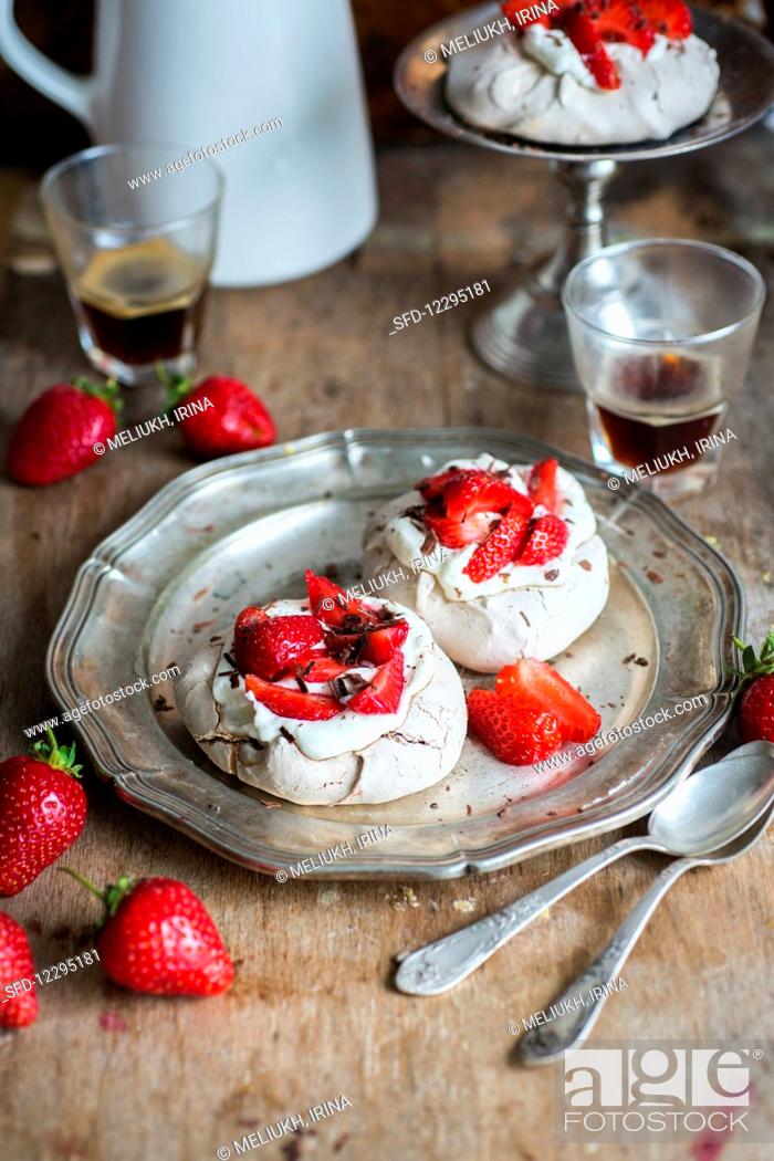 Stock Photo: Pavlovas, Baked, Baked Good, Sweeten, Recipe, Selective Focus, Copy Space, Ready-To-Eat, Food And Drink, Fragaria X Ananassa, Mini, Pavlova, Strawberry, Meringue, Focus On Foreground, Fragaria, Choc, Indoors, Interior, Small, Afters, Inside, Backgrounds, Wooden, Food, Soft, Cake, Studio Shot, Fruit, Sweet