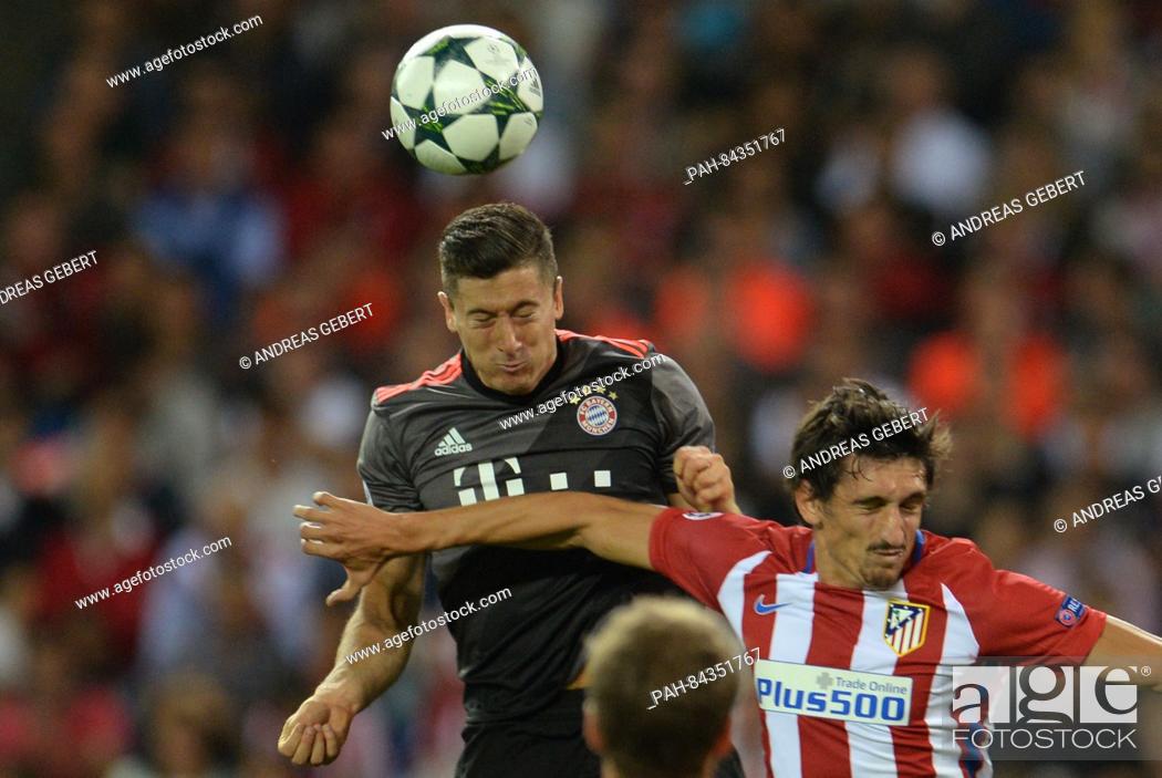 Stock Photo: Munich's Robert Lewandowski (l) and Madrid's Stefan Savic in action during the Champions League Group D soccer match between Atletico Madrid and Bayern Munich.