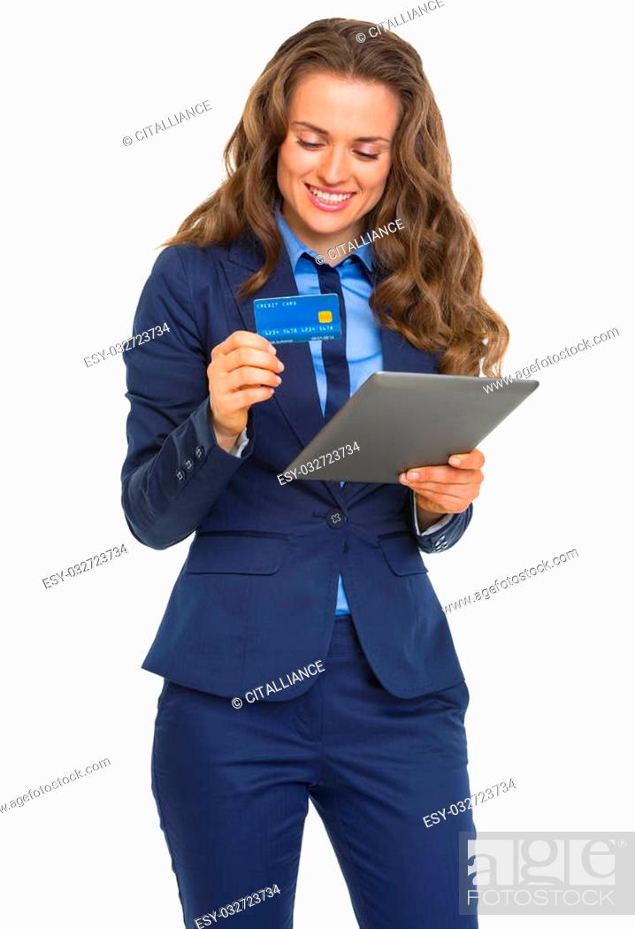 Stock Photo: Smiling business woman with credit card using tablet pc.