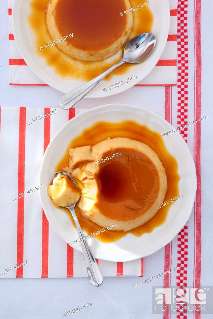 Stock Photo: Creme caramel with a bite taken out.