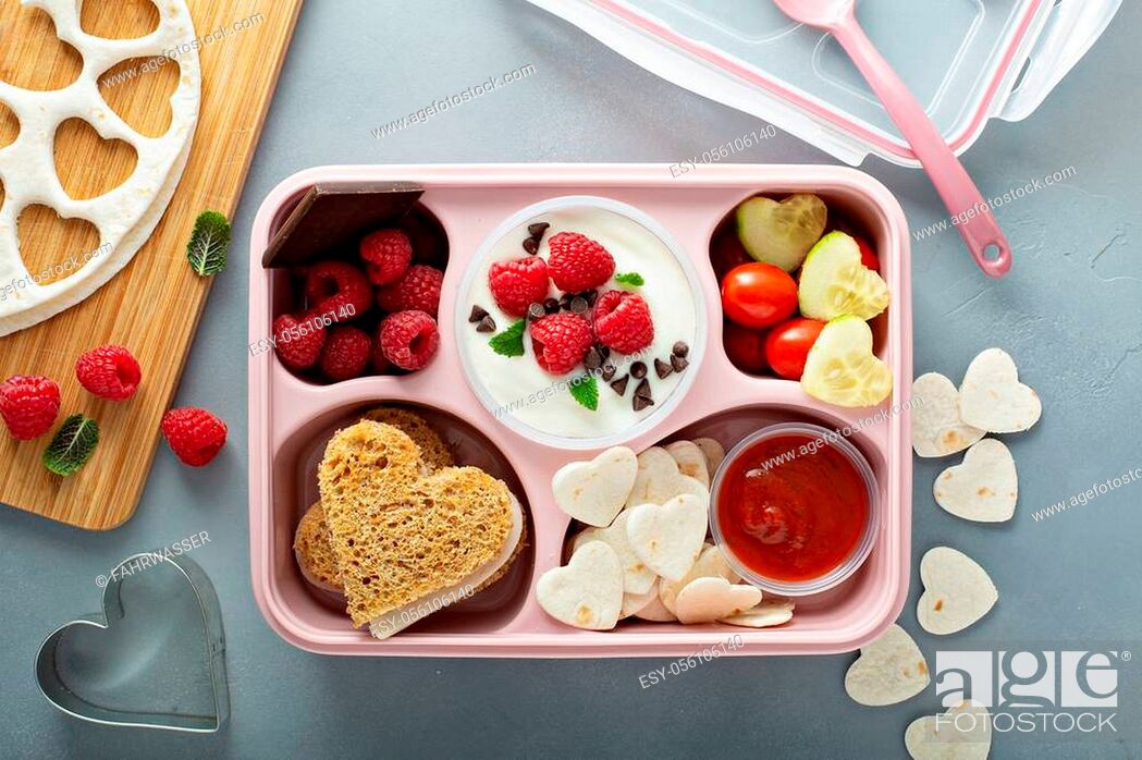 Stock Photo: Valentines day lunch for kids with heart shaped sandwich.