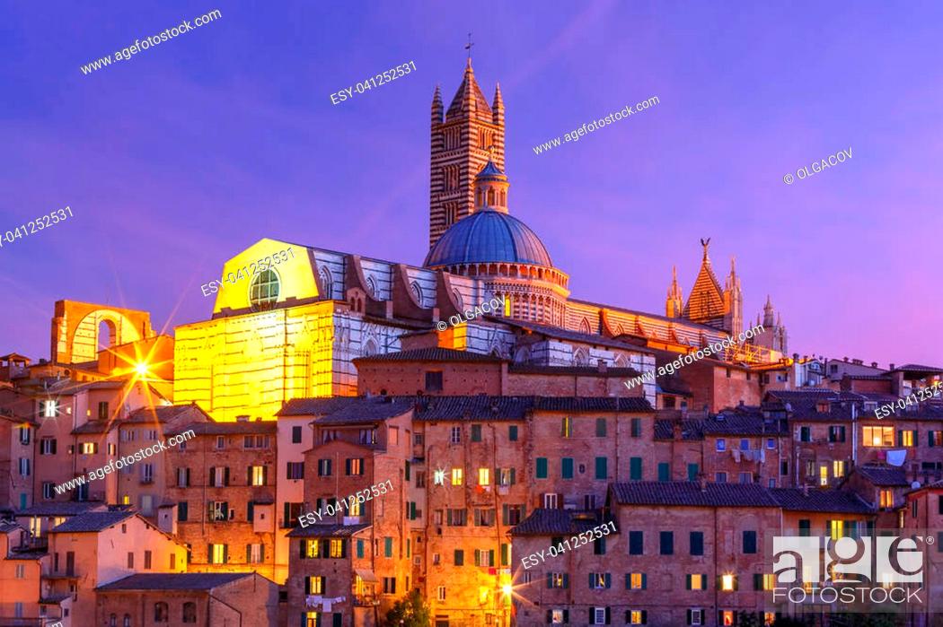 Stock Photo: Beautiful view of Dome and campanile of Siena Cathedral, Duomo di Siena, and Old Town of medieval city of Siena during evening blue hour, Tuscany, Italy.