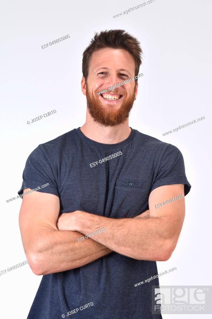 Stock Photo: portrait of a smiling man with arms crossed on white background.