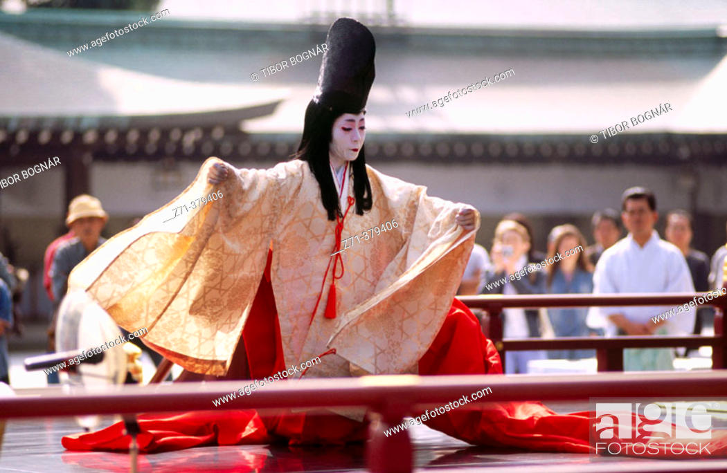 Stock Photo: Bugaku (traditional ceremonial dance and music) dancer performing in Meiji-Jingu shinto shrine. Tokyo, Japan.