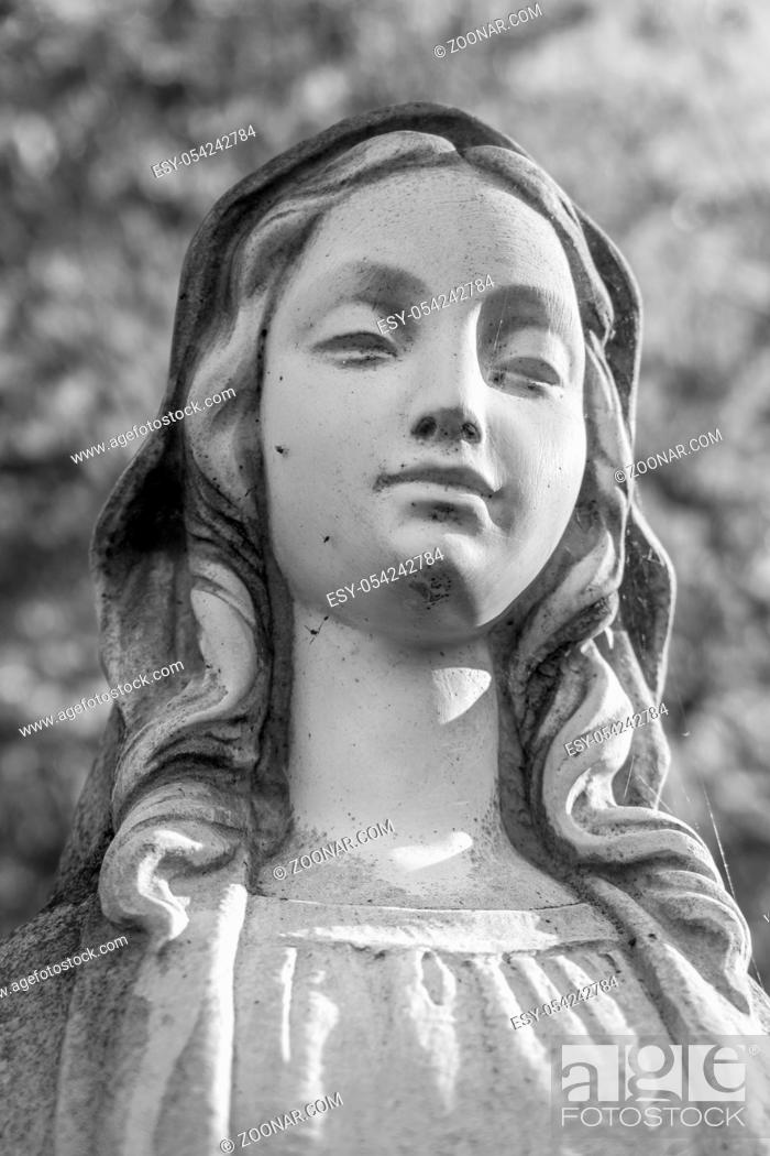 Stock Photo: Virgin Mary Statue on defocused blurry background. Ideal for concepts and festivity.
