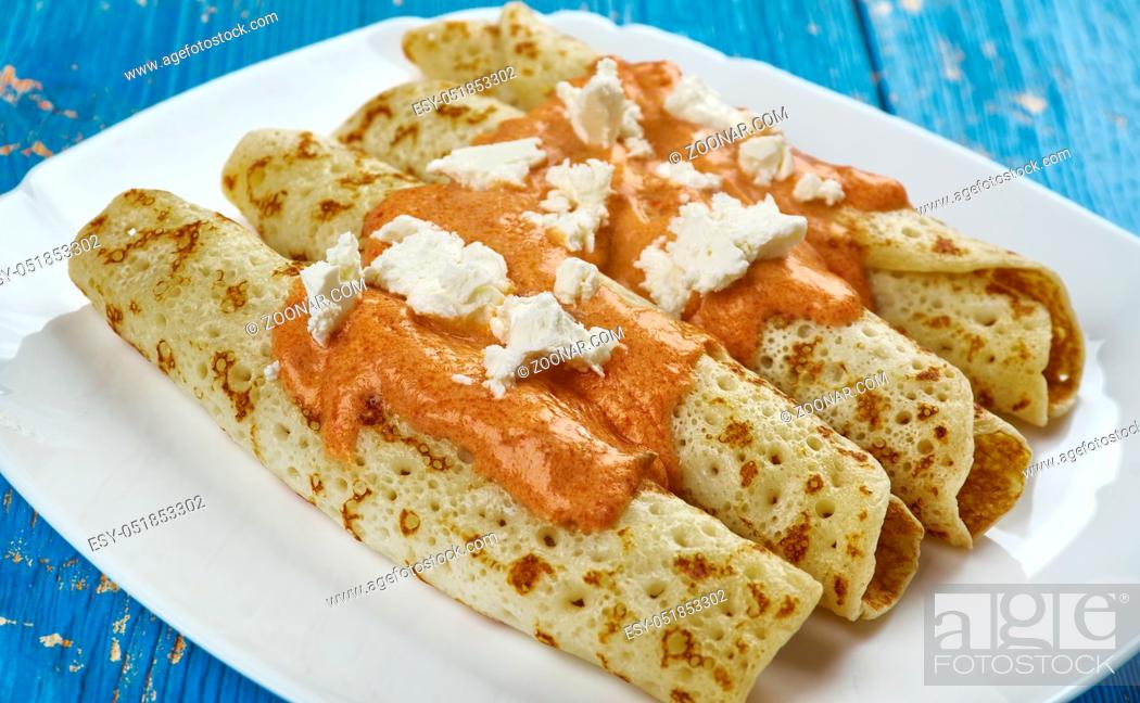 Stock Photo: Entomatada typical Mexican dish made of a folded corn tortilla which has first been fried in oil and then bathed in a tomato sauce made from tomatoes, garlic.