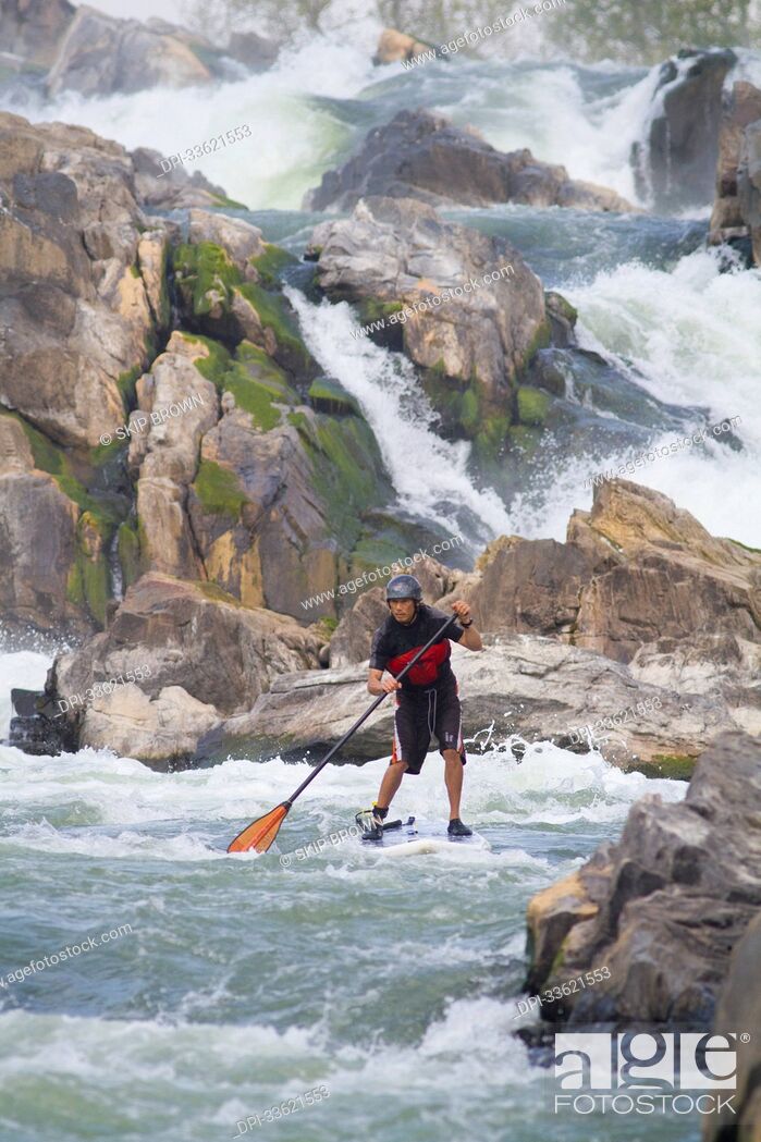 Stock Photo: A stand up paddle boarder in white water just below Great Falls.; Potomac River, Maryland/Virginia.