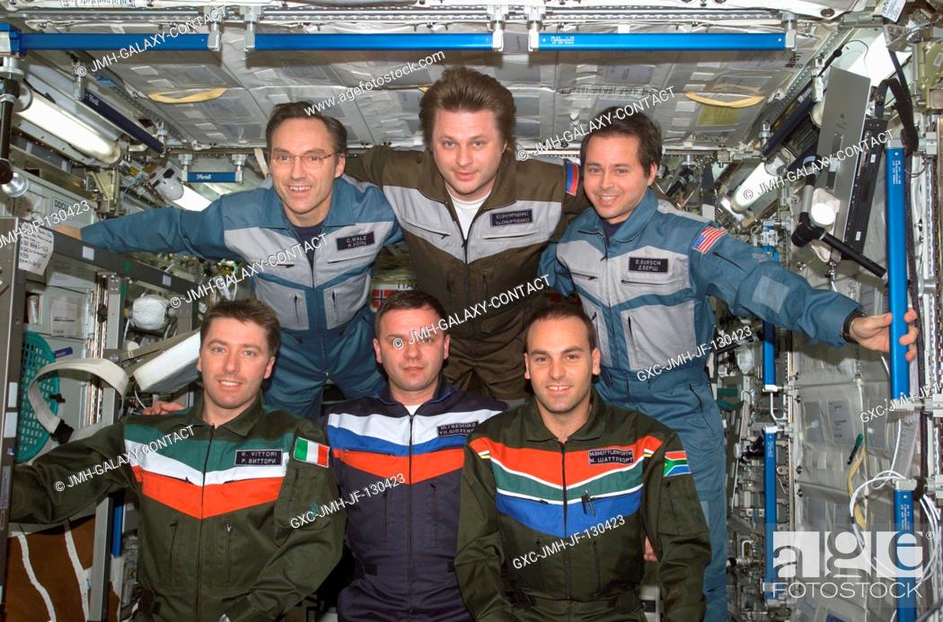 Stock Photo: The Expedition Four and Soyuz 4 Taxi crews pose for a group photo in the Destiny laboratory on the International Space Station (ISS).