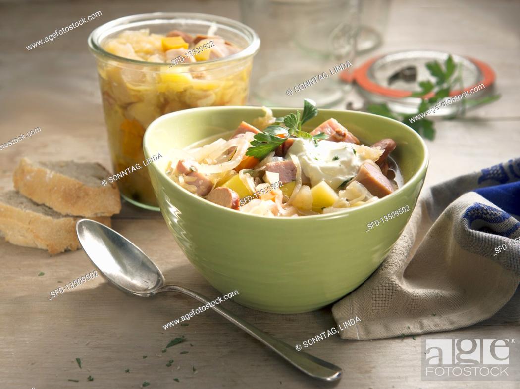 Stock Photo: Preserved hearty sauerkraut soup with smoked pork loin.
