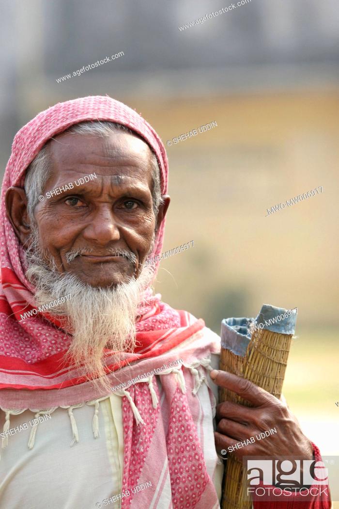Stock Photo: Portrait of an old Muslim, on his way to attend the Eid-ul-Adha prayer Mayshaghuni, Rupsha, Khulna, Bangladesh January 01.