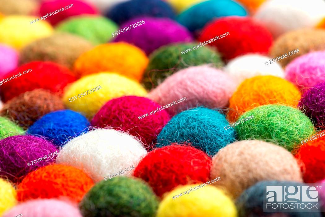 Stock Photo: Multicolored felt ball rug detail, colorful texture.