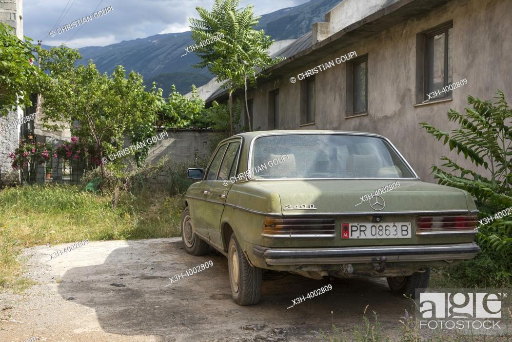 Stock Photo: Old Mercedes in a street of Permet, mountain village on the banks of the Vjosë or Vjosa river, Gjirokaster District, Albania, Southeastern Europe.