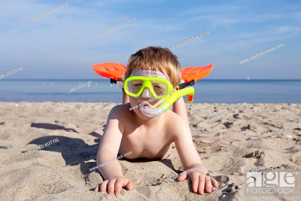 Stock Photo: Young boy with diving goggles, snorkel and flippers, beach of Kuehlungsborn, Mecklenburg-Western Pomerania, Germany.