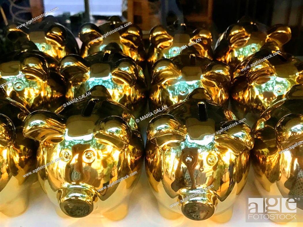 Stock Photo: Golden piggybanks.