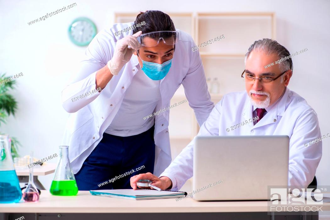 Stock Photo: The two chemists working in the lab.