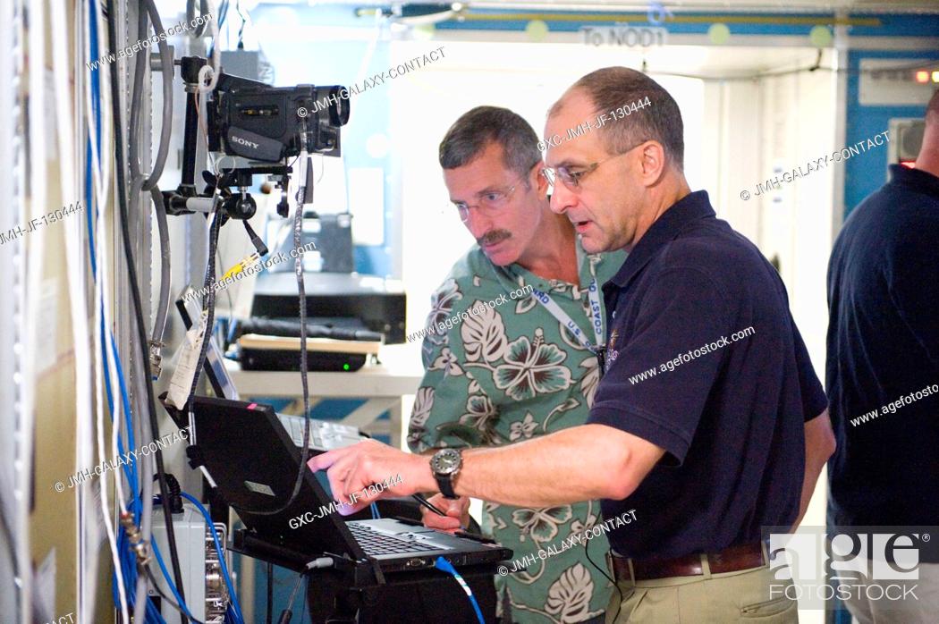 Stock Photo: NASA astronaut Dan Burbank, Expedition 29 flight engineer and Expedition 30 commander; NASA astronaut Don Pettit (foreground) and European Space Agency.