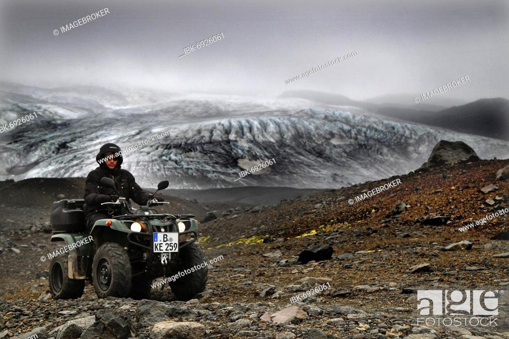 Stock Photo: Glacier edge, Glacier, ATV rider, Biker, Quad, Yamaha Grizzly, Lava desert Krepputunga, Öskjuleið, Kverkfjöll, Vatnajökull glacier, Highlands, Central Iceland.