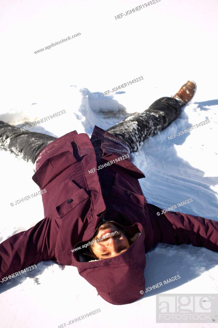 Stock Photo: Mid adult man doing snow angel, Manhattan, New York City, USA.